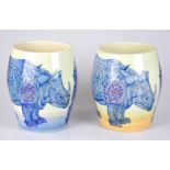 SALLY TUFFIN FOR DENNIS CHINAWORKS; a near pair of ovoid form vases, decorated with rhinos,