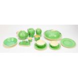 SUSIE COOPER; a breakfast set decorated with stylised half moons on a green ground, to include