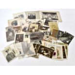 A collection of twenty-one early 20th century vintage black and white photographs from the