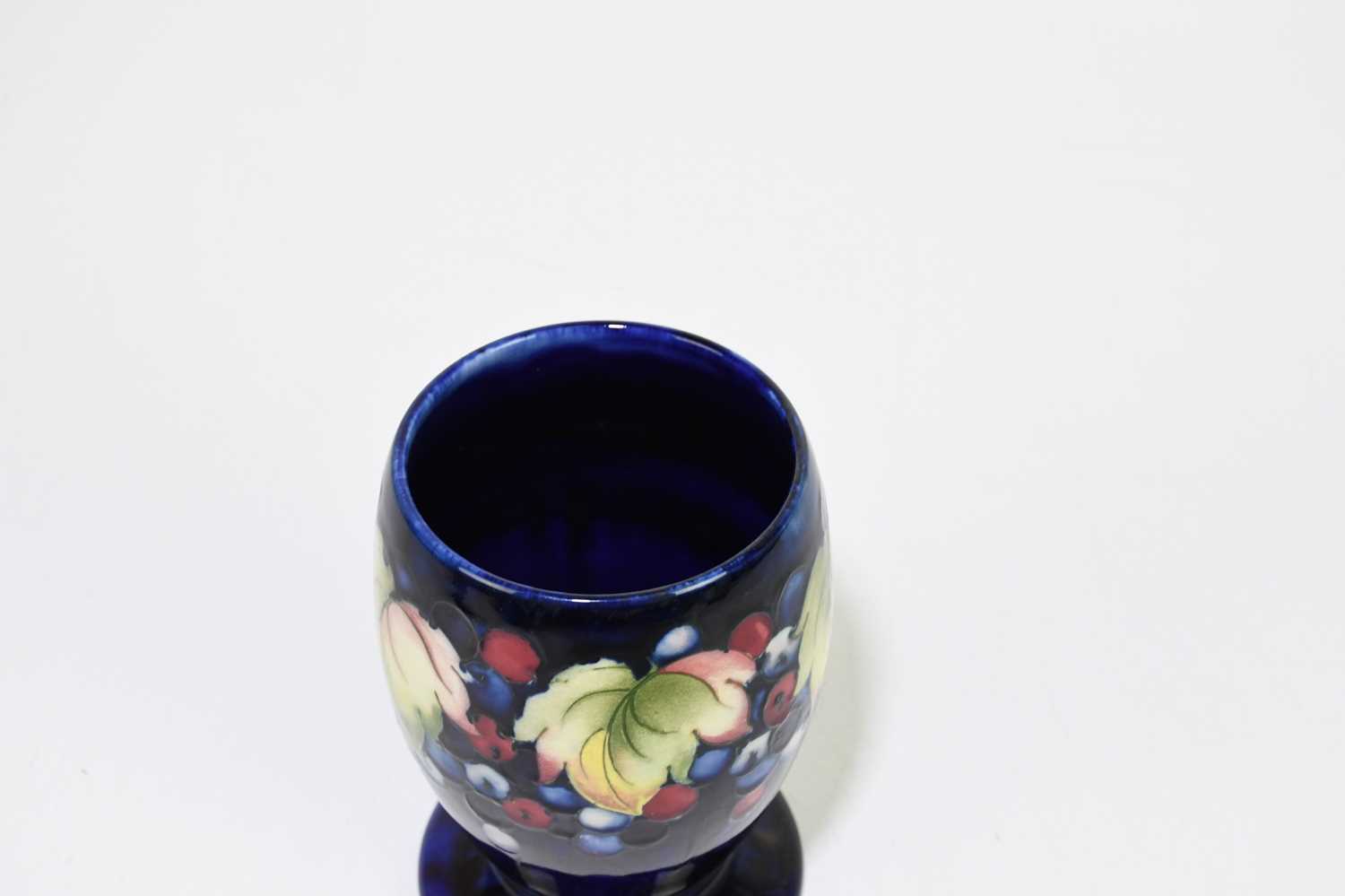 MOORCROFT; a 'Leaf and Berry' pattern vase, with a blue ground, impressed marks and painted Walter - Image 4 of 5