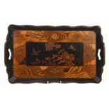 A Japanese lacquered and geometric decorated twin handled tray, decorated with birds and flowers,