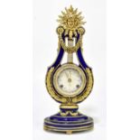 A V&A Marie Antoinette ceramic clock, with Roman numerals, height 39cm.Condition Report: