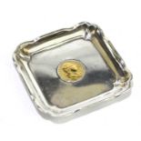 An Edwardian hallmarked silver square dish, the centre inset with a George III gold guinea dated