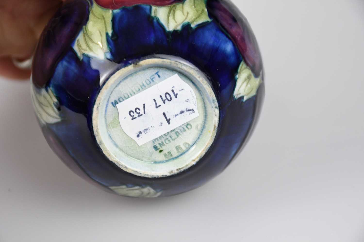 WALTER MOORCROFT; a squat vase in the 'Pansy' pattern on a blue ground, impressed marks to the - Image 4 of 4