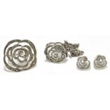 A white metal macasite set flower head ring, pendant and a pair of earrings (4)