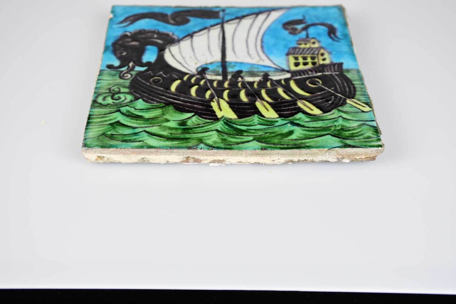 WILLIAM DE MORGAN; an Art Pottery tile painted with a galleon and three sailors with paddles, in - Image 3 of 6