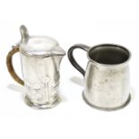 ARCHIBALD KNOX FOR LIBERTY & CO; a pewter lidded hot water pot, shape number 0967, with wicker bound