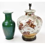 Two modern Oriental lamps, one decorated with monkeys, the second with a green ground, heights