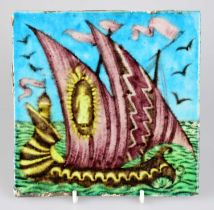 WILLIAM DE MORGAN; an Art Pottery tile painted with a two masted sailing vessel in shades of purple,