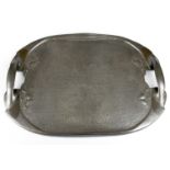 ARCHIBALD KNOX FOR LIBERTY & CO; a Tudric pewter twin handled tray with embossed stylised floral