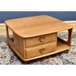 ERCOL; a mid century light elm coffee table, with an arrangement of two drawers, on fitted