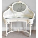 A modern white cane dressing table with swivel oval mirror, cane sides, mirrored table top over