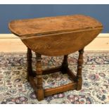 An oak drop leaf occasional table, with turned legs, height 56cm, width 66cm.