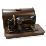 THE AVENUE; a cased sewing machine, made in South America.