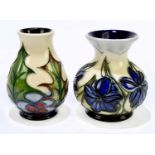 MOORCROFT; two vases, to include an example designed by Phillip Gibson, decorated in the 'Holly'