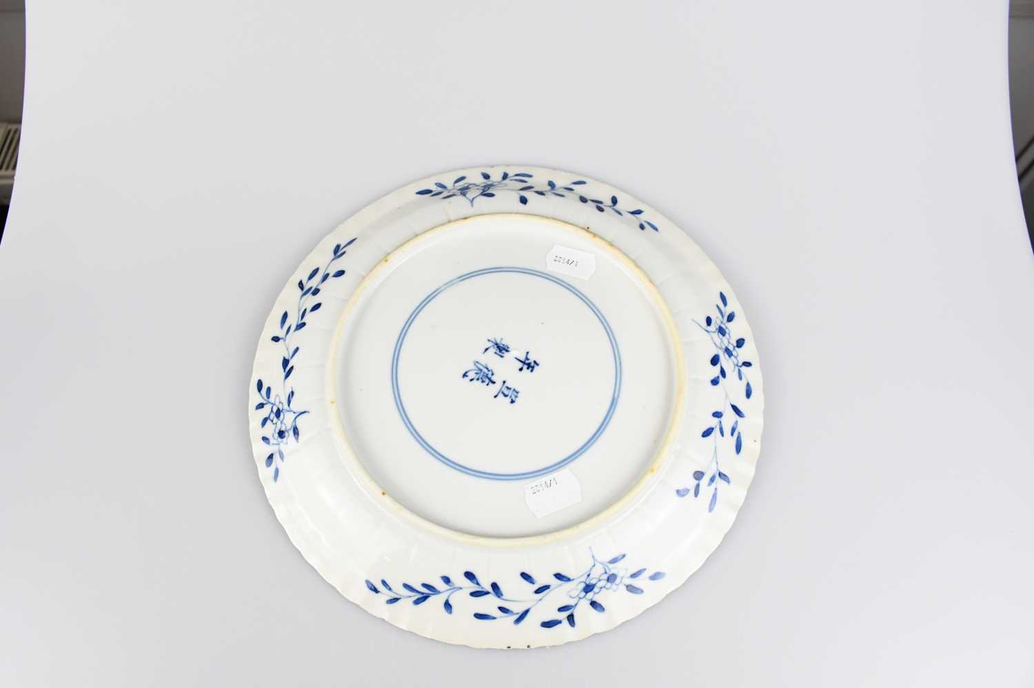 A late 19th/early 20th century Chinese blue and white porcelain plate with a prunus border outside - Image 2 of 2