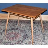 ERCOL; a light elm side table of rectangular form with undertier shelf, on turned column supports,