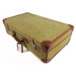 A military issue leather bound canvas suitcase, the interior stamped with the initials 'P.I', a