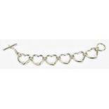 TIFFANY & CO; a sterling silver heart bracelet, length 19cm, approx weight 31g.