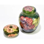 MOORCROFT; a ginger jar and cover decorated in the 'Hibiscus' pattern, height 20cm, and a powder