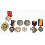 A collection of hallmarked silver and silver plated medals, including a hallmarked silver and enamel