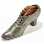 A pewter shoe pin cushion, 7cm.