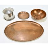 HUGH WALLIS; a copper oval serving tray, length 44cm, with a circular bowl, with a small circular