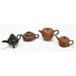 Three Chinese redware Yixing type teapots, including one of oval form with naturalistic detailing,