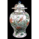 A 19th century Chinese Famille Verte Wucai porcelain temple jar and cover painted with a band of