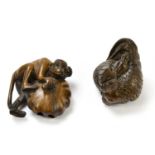 Two contemporary carved wooden netsuke, one modelled as a hen and chick, the second as a monkey