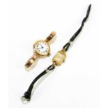 A 9ct gold cased lady's wristwatch, the enamel dial set with Roman numerals on a 9ct gold strap,