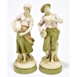 ROYAL DUX; a pair of figures representing water carriers, height 30cm (2).