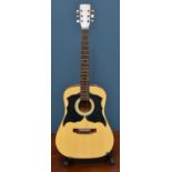 An acoustic six string classic guitar, label to inside, model no. K450. Condition Report: Neck has