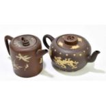 Two Chinese redware Yixing teapots, one with painted floral detailing, the other with applied