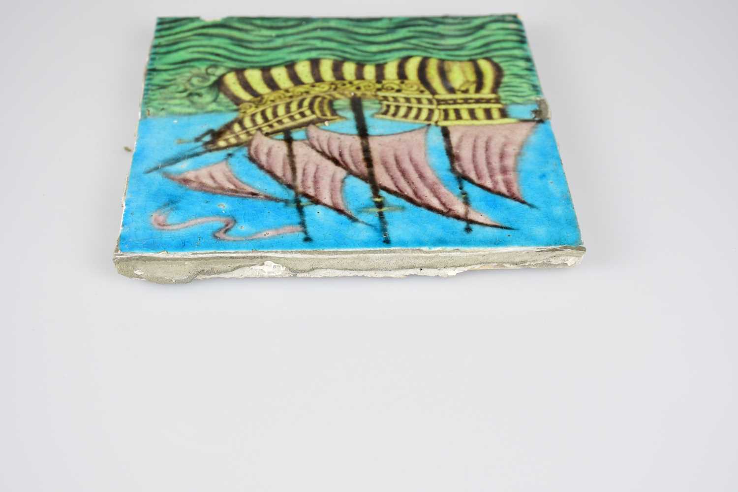 WILLIAM DE MORGAN; an Art Pottery tile painted with a four masted galleon ship, in shades of purple, - Image 5 of 6