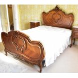 A mahogany French style bed with carved headboard and footboard (probably kingsize), 212 x 62cm,