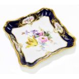 MEISSEN; a porcelain serpentine square dish, painted with a central floral spray, width 20.5cm.