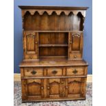 A 19th century oak dresser with three drawers over three cupboard doors, height 190cm, width