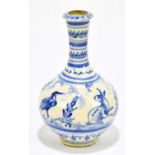A Middle Eastern pottery blue and white vase, decorated with rabbits, deer and bird, unsigned,