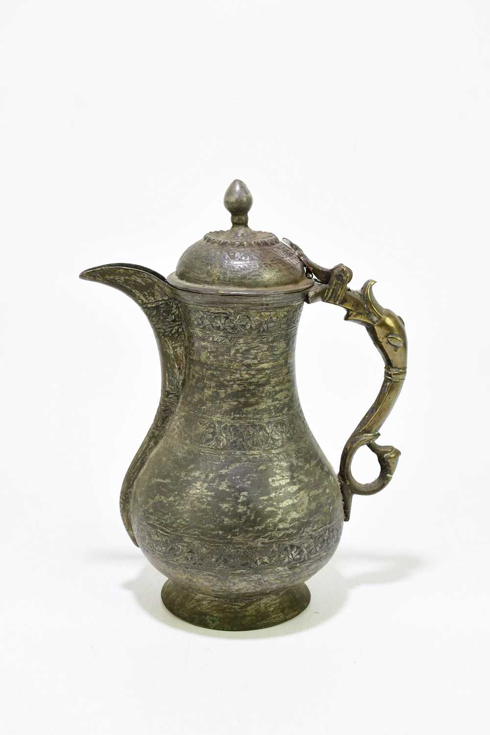 A 19th century Persian metal ewer, with foliate detailing and serpent handle, height 23cm. - Image 2 of 3