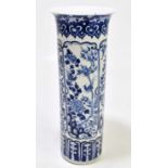 A 19th century Chinese blue and white porcelain sleeve vase, decorated in panels with exotic
