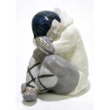 LLADRO; a figure of a sleeping Inuit, height approx 25cm.Condition Report: Grubby throughout which