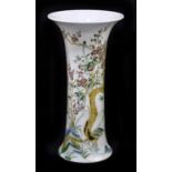 A Japanese flared rim vase, decorated with bamboo and rock work, four character mark to the