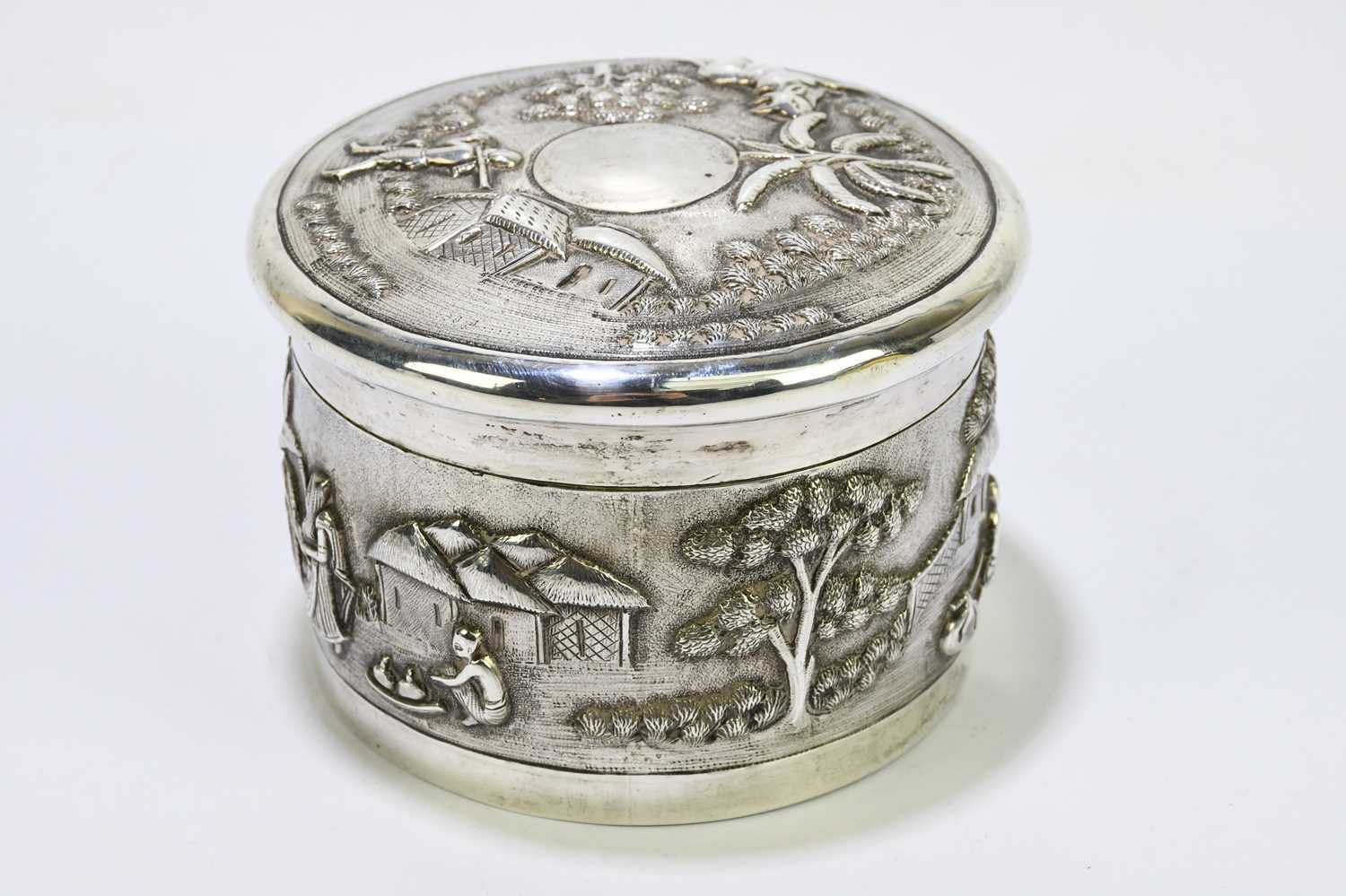 An Indian white metal lidded trinket box, decorated with village scenes. - Image 3 of 5