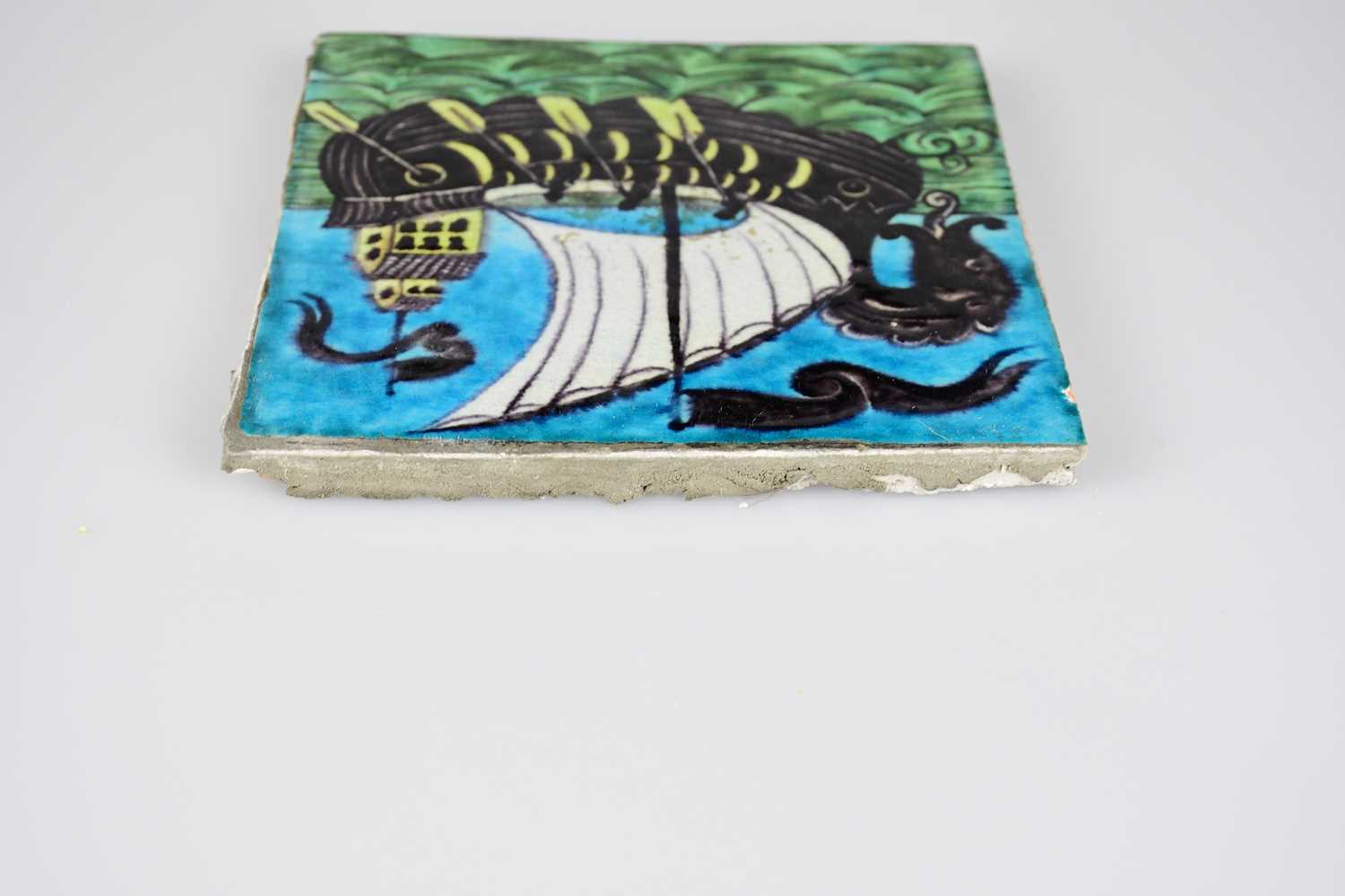 WILLIAM DE MORGAN; an Art Pottery tile painted with a galleon and three sailors with paddles, in - Image 5 of 6