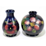 MOORCROFT; a 'Pansy' pattern vase, impressed marks, height 11.5cm, with an 'Anemone' globular