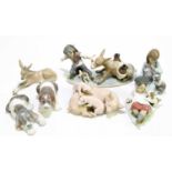 LLADRO; a group of four animal models comprising two recumbant puppies, a sow and two piglets, a
