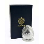 FABERGÉ; a modern glass paperweight in the form of an egg with engraved decoration with sleeping
