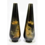 A pair of Japanese engraved bronze vases, decorated with simple landscapes, height 24cm (2).