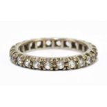 A 9ct yellow gold white stone set full eternity ring, size O 1/2, approx. 3.3g.